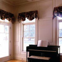 Paneled Wainscoting by piano in living room