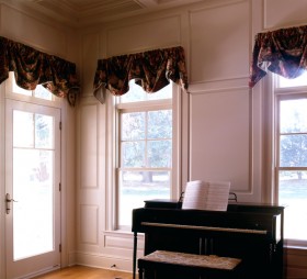 Paneled Wainscoting by piano in living room