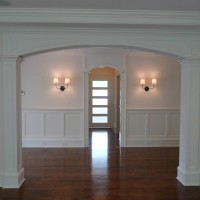 Archway to dining room to featuring Paneled Columns
