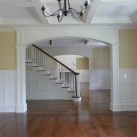 living room and entry way with custom wainscot paneling