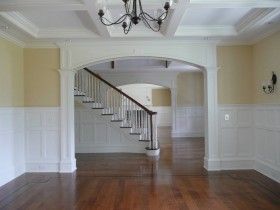 living room and entry way with custom wainscot paneling