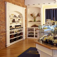 white display case with brick backing at store