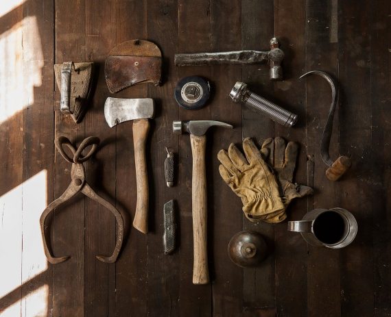 home tools on floor laid out for project - DIY Wainscoting project concept image