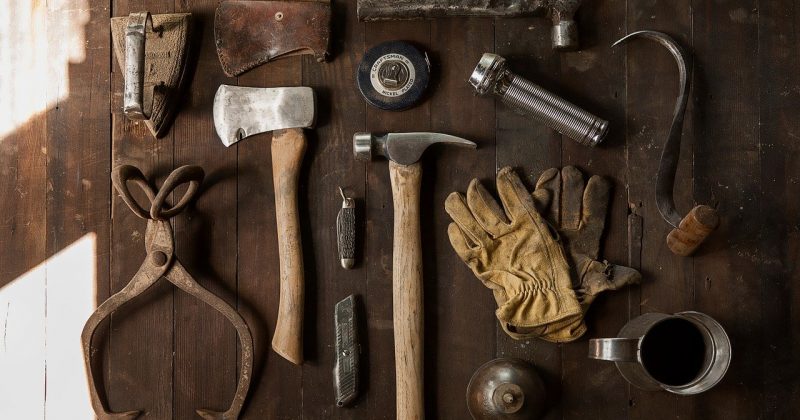 home tools on floor laid out for project - DIY Wainscoting project concept image