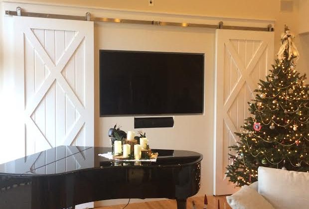 living room with sliding doors and piano - paneled wainscoting